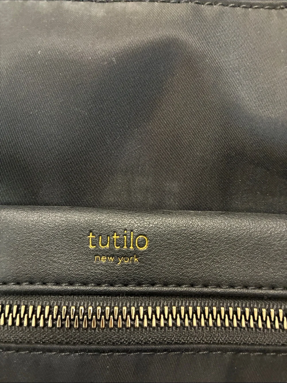 Tutilo Black Men's Backpack with Gold Zipper Accents